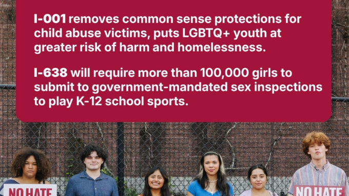 A picture of young people holding signs opposing I-001 and I-638.